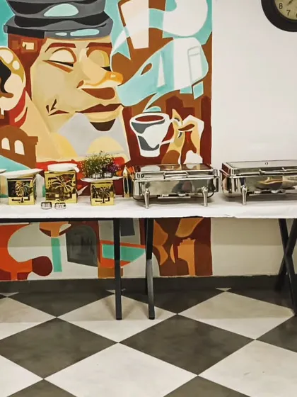 A stylish buffet setup against a cool mural at the URBAN PLUS office in Sector 29, Gurgaon. I catered for 60 guests, transforming their workspace into a dining experience.