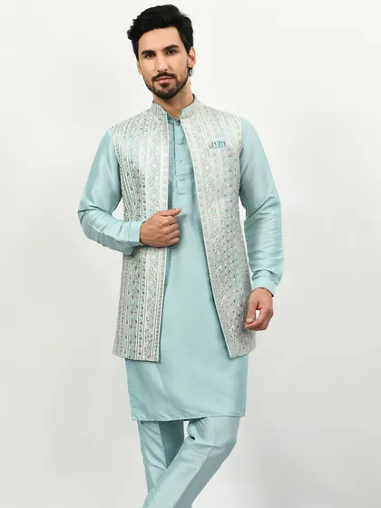 Last minute invite? A Kurta Pajama Jacket is the answer. This pastel blue set with an embroidered jacket offers style, comfort, and a budget-friendly option for any wedding event.