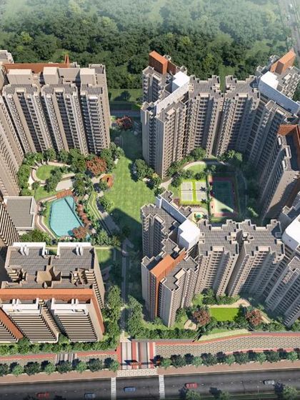 Another aerial perspective of the township, highlighting the layout of the swimming pool, sports courts, and central lawn within the U-shaped building footprint.