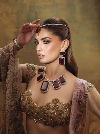 A side profile of this dreamy, editorial look. The makeup is designed to be dramatic and captivating.