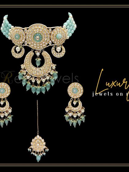 My mint green Kundan choker set is all you need to get all eyes on you. The crescent-shaped motifs and matching earrings make it a luxurious choice.