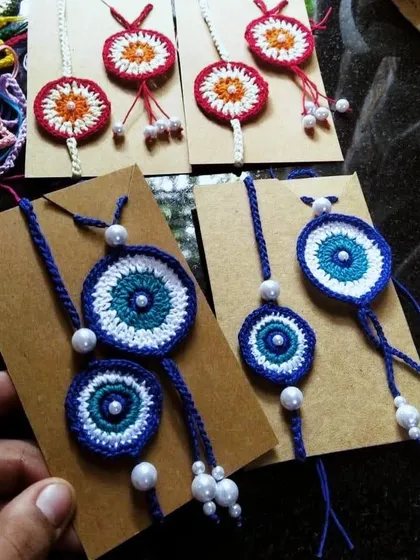 We believe in celebrating the *pyaar ka bandhan* with a personal touch. Our handmade evil eye rakhi and lumba sets are designed to protect your loved ones from *buri nazar* during Rakshabandhan.