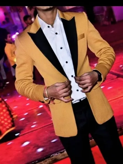 For parties and celebrations, I create statement blazers that stand out. This custom mustard yellow blazer features a contrasting black shawl lapel, creating a sharp, modern look perfect for a wedding reception or a special night out.