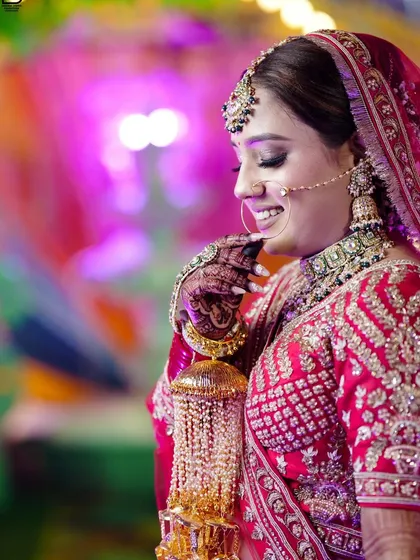 A side profile of the bride smiling, capturing a moment of pure happiness.