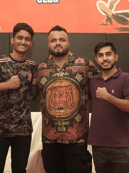 Me with two of our dedicated fighters during a team celebration. It's important to recognize the hard work they put in day in and day out.
