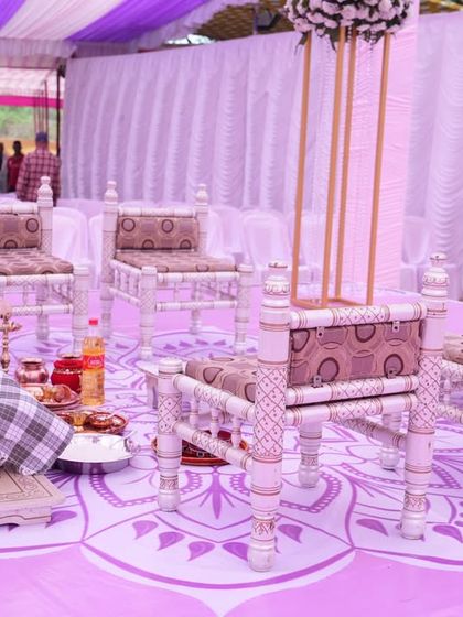 A close-up of the sacred space within the Vidhi Mandap. We ensure every detail is perfect, from the custom-printed floor with a mandala design to the traditional 'paat' seating for the bride and groom.
