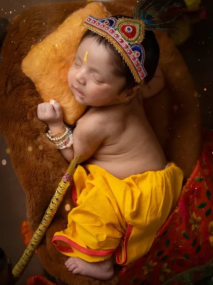 My favorite from the Krishna series. Baby Krishay, just a few days new, peacefully dreaming. This Krishna theme for newborns is a beautiful way to celebrate a divine beginning.