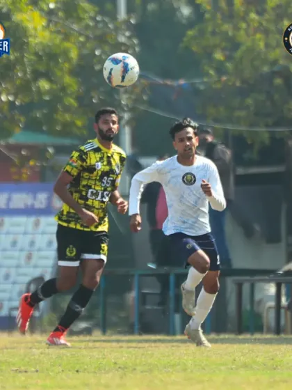 An aerial duel near the goal, showing the bravery of our players in attacking and defensive situations.