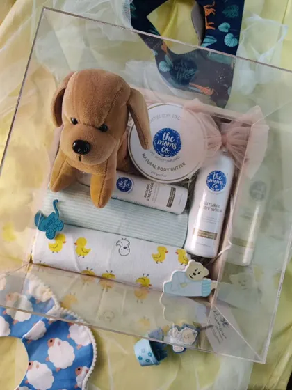 Celebrating new beginnings is one of our favorite things to do. This baby announcement hamper is packed with care, featuring a soft toy, gentle baby care products, and soft swaddle cloths for the little one.