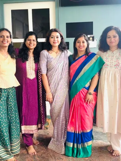 A group photo with some of the wonderful women of our yoga community during our anniversary celebration. Their support and trust have been the foundation of our growth.