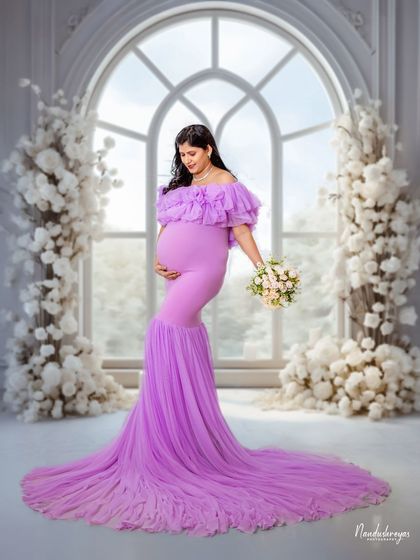 A duplicate of 110, this portrait shows the full grandeur of the lavender gown and the romantic, flower-filled studio set.