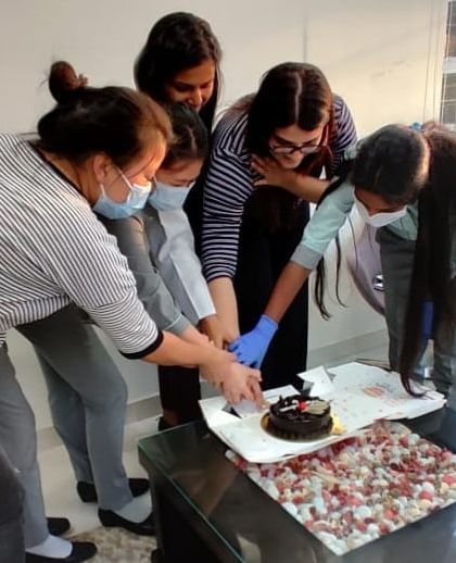 Teamwork makes the dream work! Celebrating together with a cake cutting for Women's Day at the clinic.