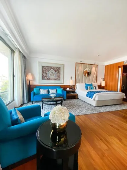 For the Intercontinental Mumbai, I designed this suite as a symphony of coastal elegance. The vibrant teal upholstery and bespoke furnishings are set against warm wood and natural light, creating a luxurious yet comfortable retreat that mirrors the spirit of the sea.