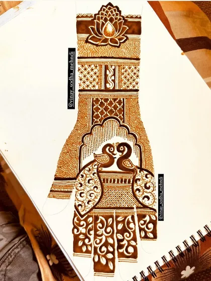 A lovely design featuring a pair of peacocks, sketched out to perfect the composition. This is a great example of the practice work we do to master popular bridal motifs.