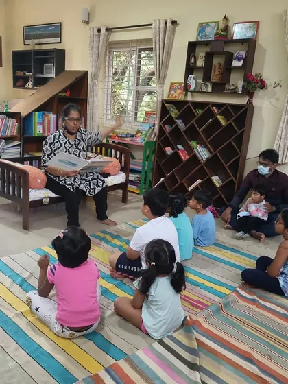The storyteller reads the story of "The Dolphin," a tale of community and helping animals in need.