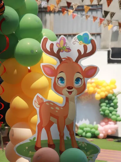 A charming deer cutout with butterflies, part of the gentle and friendly side of our jungle theme decor.