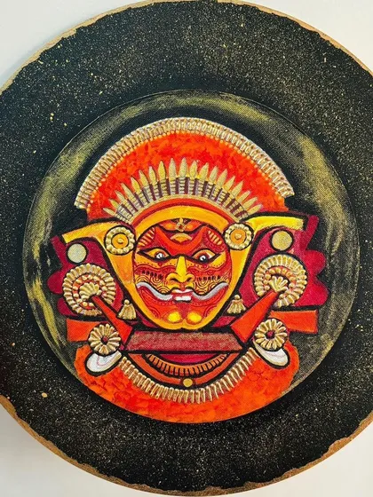Feel the divine energy of Kerala's Theyyam ritual with this hand-painted wooden wall plate. The intense expression, fiery colors, and textured background are my attempt to capture the mystical aura of this ancient and awe-inspiring folk dance form.