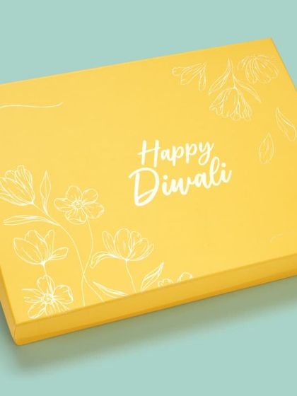 A modern yellow "Happy Diwali" gift box. We shoot seasonal packaging for brands to use in their festive catalogues.