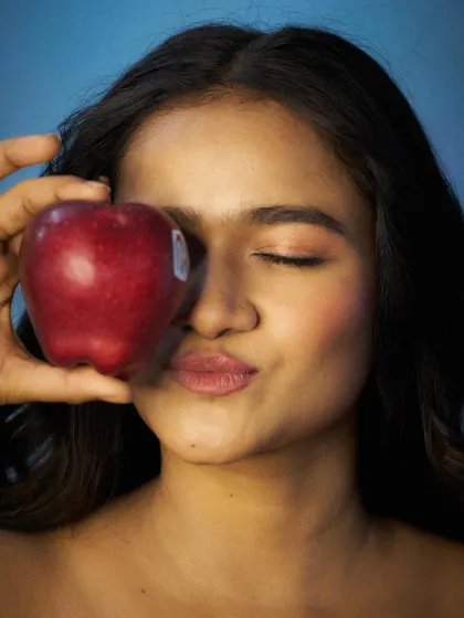 A softer, more subtle pose for a beauty or wellness concept. This shot highlights a natural look, perfect for skincare or healthy lifestyle product modeling.