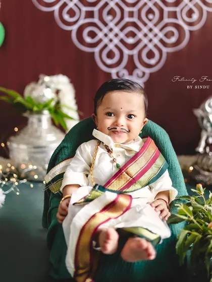 A full-length shot of a little boy in traditional Ugadi attire, looking absolutely charming.