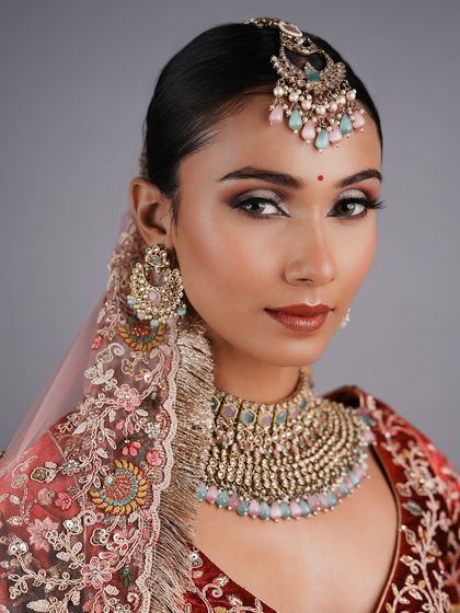 This modern bridal look with a unique color combination was designed and created by a student, showing their creative confidence.