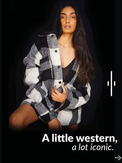 Here's another way to style the plaid shacket, worn open over a simple black top. It's a versatile piece that shows how we can create multiple looks for your personal style.