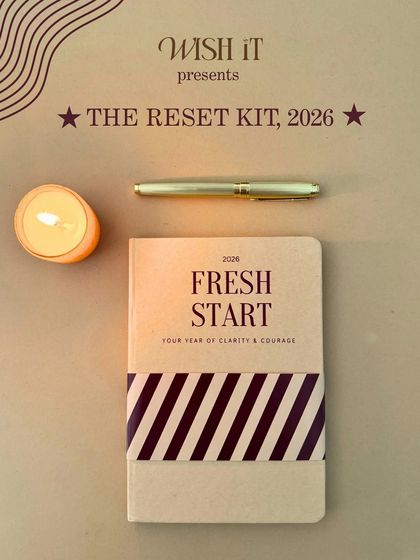 The "Reset Kit" presented in a warm, candle-lit setting. It's a gift that says "I believe in your journey" and encourages a fresh start.
