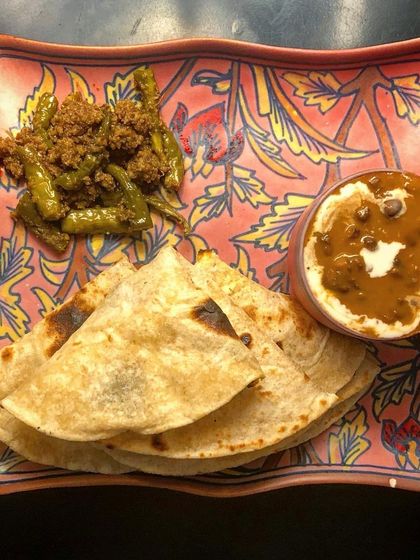 Our Hari Mirchi ka Achaar adds the perfect spicy kick to any meal. Here it is served with dal makhani and roti. I make this green chilli pickle with fresh chillies, so the spice level is a little different and exciting with every batch.