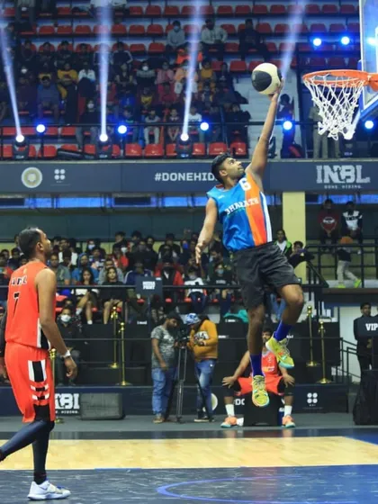 I don't just coach the game, I still play it at a high level. Here I am driving for a layup during the INBL 3x3 tournament. This is the kind of real-game experience and intensity I bring to my coaching.