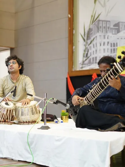 A focused moment during a sitar recital with Ustad ji in Bhopal. Providing the right rhythmic foundation (theka) is crucial for the artist to explore the depths of the raga.