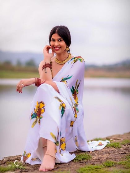 A joyful and radiant smile by the water's edge. This portrait is full of warmth, happiness, and the beauty of the natural world.