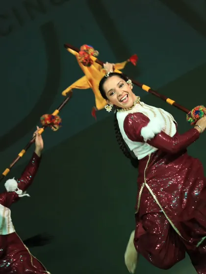 The power and energy of Bhangra! This is one of our folk dance teams bringing the house down with their vibrant performance. The colorful props and high-energy moves always get the crowd cheering.
