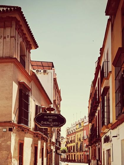 The entrance to the Alameda de Hércules, a famous plaza in Seville known for its vibrant Flamenco scene. Being in these spaces, where the art form lives and breathes, is essential to my practice and ensures I am always connected to its source.