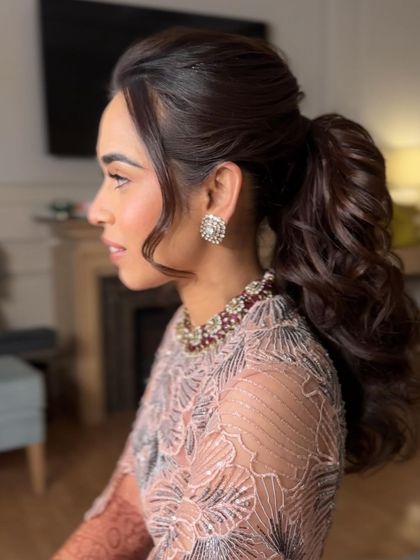 A side profile of the high ponytail, showing the height and volume I create for a dramatic and long lasting style.