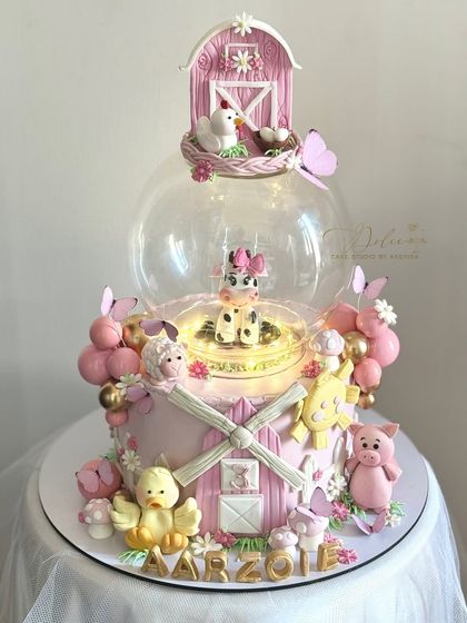 The farmland cake with the globe light turned on. Adding simple lighting elements can make your fondant creations even more magical.