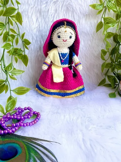 The divine couple, Radha and Krishna. I made this beautiful pair to celebrate the festival of Holi. Radha's lehenga and Krishna's turban are crafted with bright, festive colors.