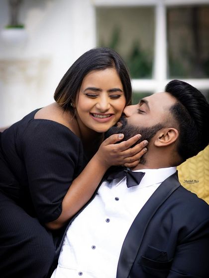 A sweet and playful moment. Her makeup is fresh and natural, with a beautiful smile being the main focus.