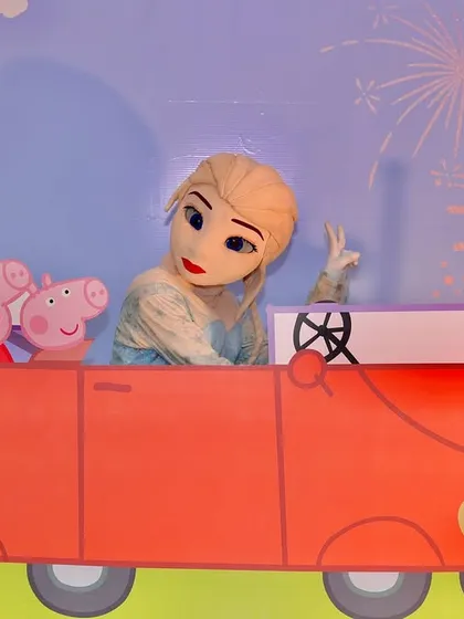 A fun photo opportunity with Queen Elsa and Peppa Pig characters in the red car prop. This shows how I can mix and match themes to create a unique party for the birthday child.