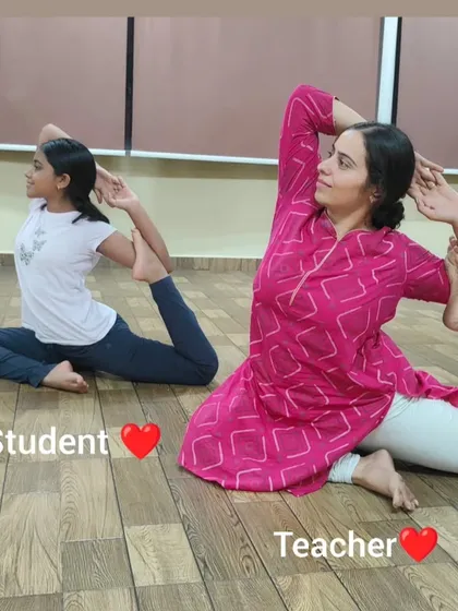 A lovely moment of a student and teacher practicing a variation of Rajakapotasana (Pigeon Pose) side-by-side. I guide students of all ages to find their own expression of a pose.