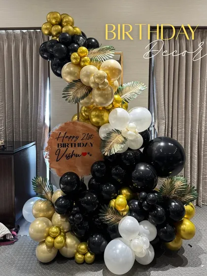 A closer look at the elegant balloon arrangement for Vishu's 21st. The custom sign and floral details make it truly unique.