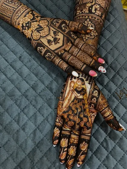 A detailed back-hand design featuring a bride portrait and personalized initials. The use of negative space makes the figures pop.