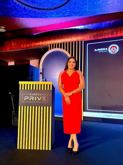 Ready to host "The Grand Welcome" for Ajmera Realty. I bring a touch of elegance and excitement to luxury real estate launches.