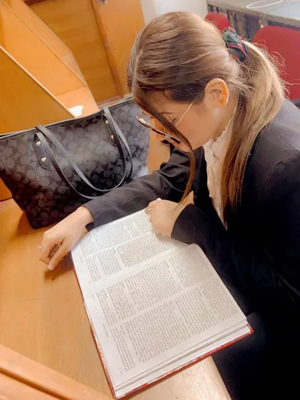 Taking a moment to review case law in the court library. Happiness for me is being a lawyer and loving every aspect of it, including the endless reading.