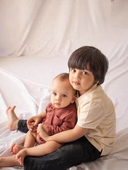 Capturing the sweet, protective bond between siblings is one of my favorite things. This tender moment between an older brother and his baby sibling is a memory to cherish forever.