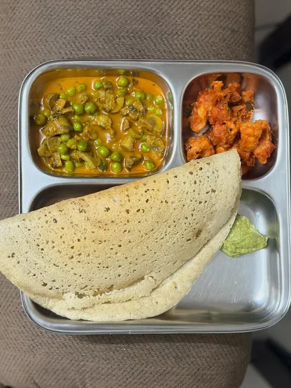 A satisfying meal of dosa with mushroom and peas curry and a side of prawns. This shows how you can mix and match different cuisines and ingredients.