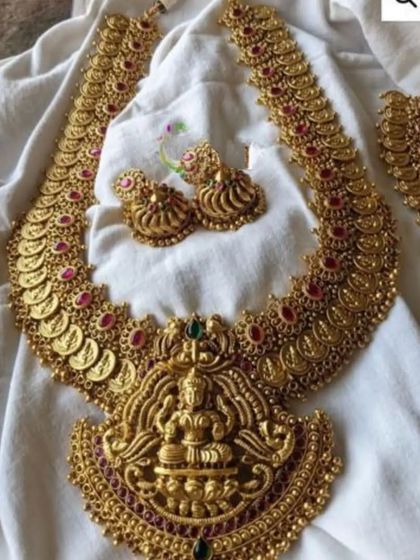 A beautiful long haaram featuring a large goddess pendant and coin details along the chain. This piece can be rented on its own or as part of a larger set to add grandeur to your bridal attire.