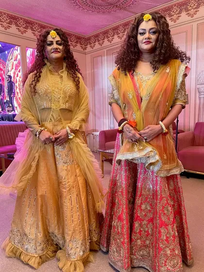 Posing in our beautiful yellow and pink lehengas on day five of Navratri. We love dressing up for the festival and celebrating each day's color.