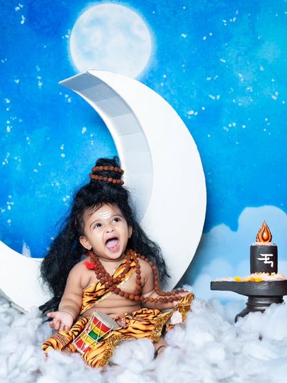 An energetic and happy little Shiva, roaring with joy on his celestial seat.
