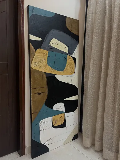 An abstract piece with a mix of textures and shapes, ready to be shipped. The combination of colors like teal, brown, and black makes it a versatile piece for modern interiors.