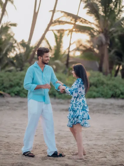 A playful dance on the sand as the sun sets. This shot captures the fun and carefree spirit of the couple's relationship during their romantic beach pre-wedding session.